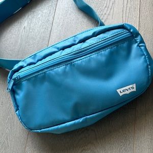 Levi's medium blue sling bag, new without tag.